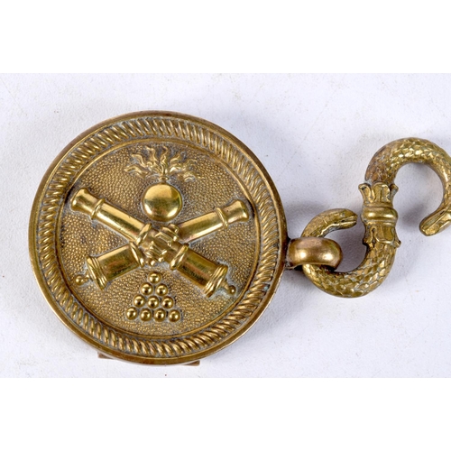 1311 - A PAIR OF ANTIQUE BRASS MILITARY BADGES. 4.5 cm wide.