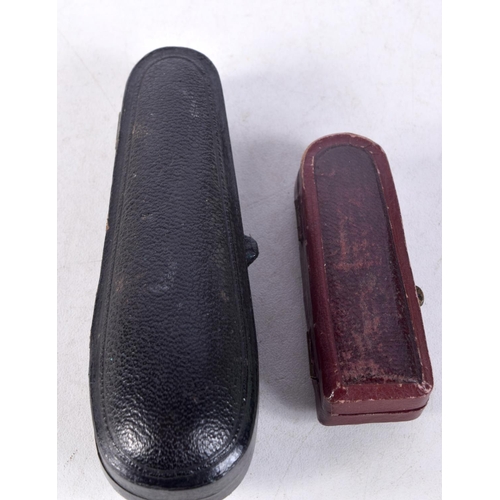 1317 - TWO CASED CHEROOT PIPES. Largest 9 cm x 2.5 cm. (2)