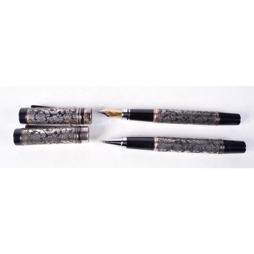 1323 - A PAIR OF SILVER OVERLAID PENS. 85 grams. 13 cm x 2 cm.