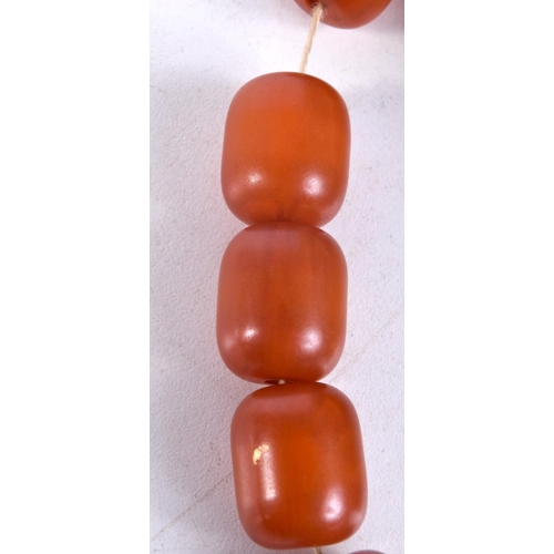 1332 - A VINTAGE AMBER TYPE PRAYER BEAD BRACELET. 52 grams. 26 cm long.