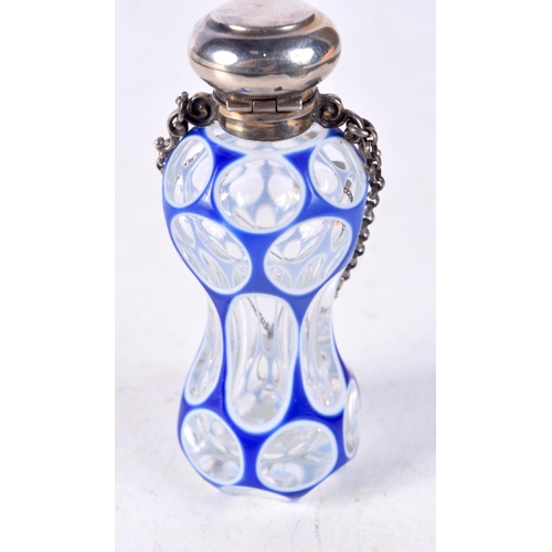 1340 - A VICTORIAN SILVER MOUNTED BLUE OVERLAID GLASS SCENT BOTTLE. 58 grams. 7.5 cm x 3 cm.