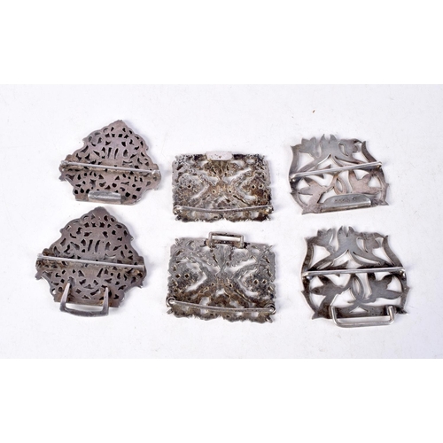 1353 - THREE ANTIQUE WHITE METAL BELT BUCKLES. 128 grams. Largest 10 cm x 5.5 cm. (3)