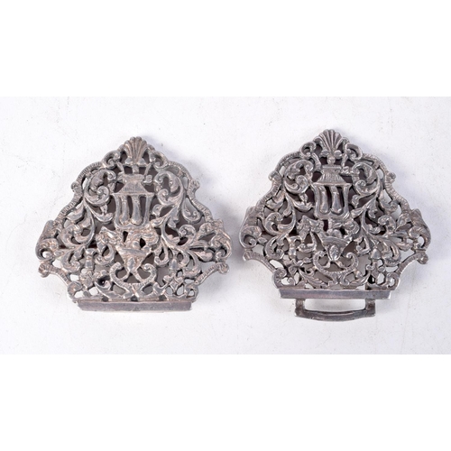 1353 - THREE ANTIQUE WHITE METAL BELT BUCKLES. 128 grams. Largest 10 cm x 5.5 cm. (3)