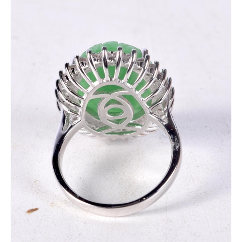 1355 - A CHINESE SILVER AND JADE RING. 9.2 grams. Q/R.