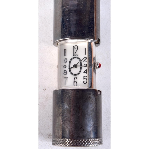 1387 - A VINTAGE WHITE METAL CYLINDRICAL WATCH. 8 cm x 2 cm extended.