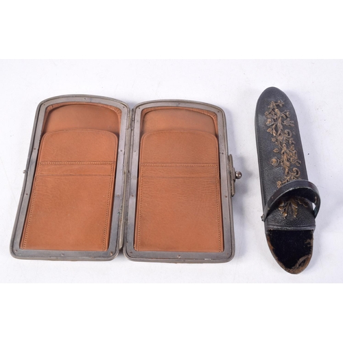 1405 - AN ANTIQUE PURSE and a glasses case. Largest 15.5 cm x 3.5 cm. (2)