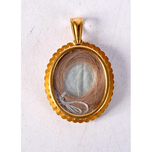 1406 - A 15CT GOLD SEED PEARL LOCKET. 5.8 grams. 3.5 cm x 2.25 cm.