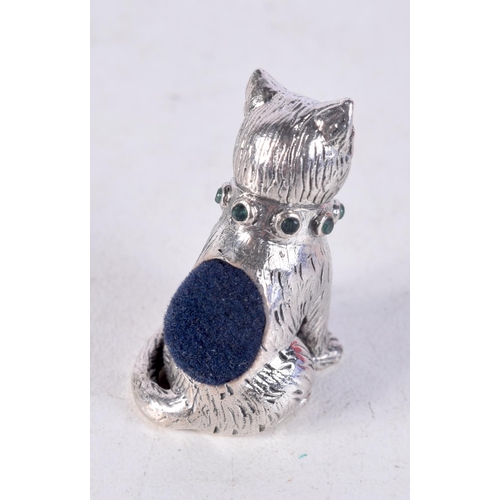 1415 - A SILVER CAT PIN CUSHION. 14 grams. 3 cm x 2 cm.