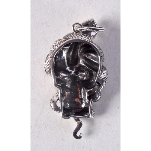 1426 - A SILVER SKULL PENDANT. 12 grams. 5.5 cm x 2.5 cm.