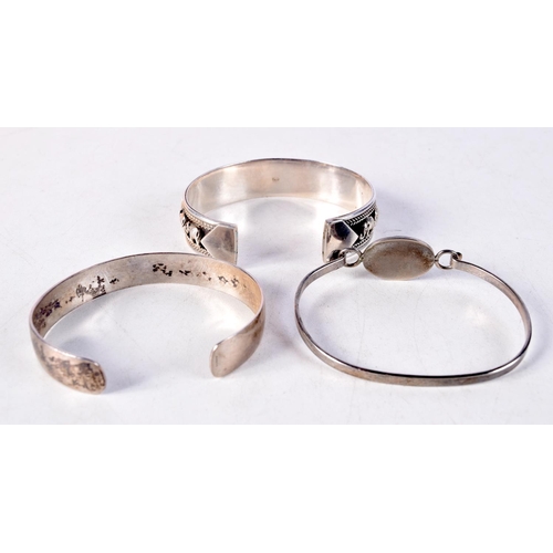 1429A - THREE SILVER BANGLES. 58 grams. 6 cm x 5 cm. (3)