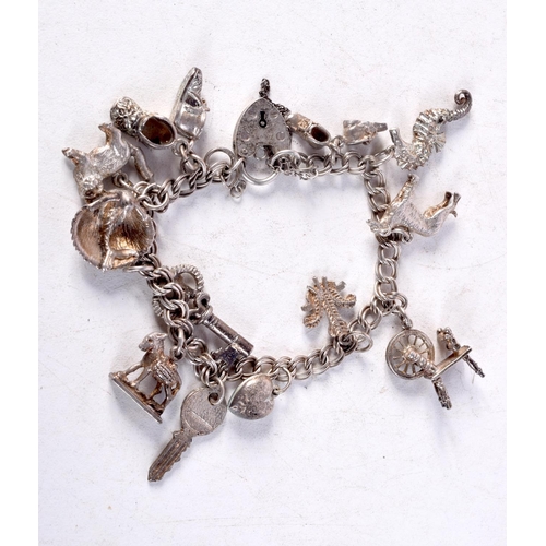 1429D - A SILVER CHARM BRACELET. Birmingham 1954. 37 grams. 18 cm long.