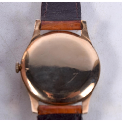 1431E - A 9CT GOLD GARRARD WRISTWATCH. 3.5 cm wide inc crown.