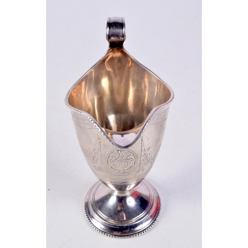 1449 - A VICTORIAN SILVER HELMET SHAPED JUG. 124 grams. 14 cm x 11 cm.