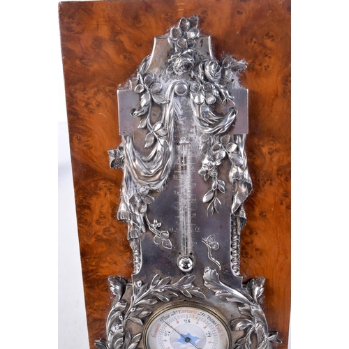 1452 - A FINE ART NOUVEAU FRENCH SILVER MOUNTED WALNUT DESK BAROMETER decorated with repousse foliage. 27 c... 