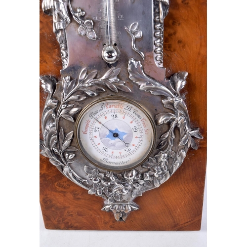 1452 - A FINE ART NOUVEAU FRENCH SILVER MOUNTED WALNUT DESK BAROMETER decorated with repousse foliage. 27 c... 