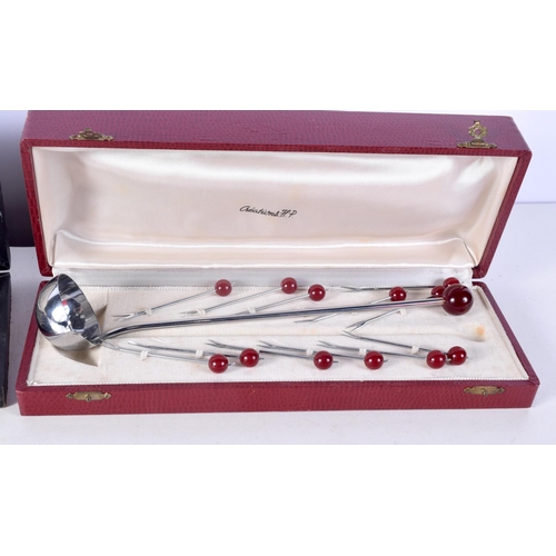 1465 - A SET OF ART DECO CHERRY AMBER CAPPED SPOONS together with a set of art deco glass knife rests. (qty... 