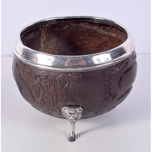 1470 - A RARE 18TH/19TH CENTURY IRISH SILVER MOUNTED COCONUT BOWL decorated with animals and shamrock. 14 c... 