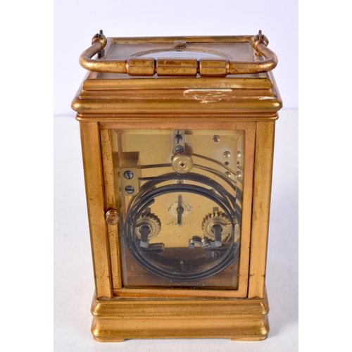 1471 - AN ANTIQUE REPEATING CARRIAGE CLOCK. 18 cm high inc handle.