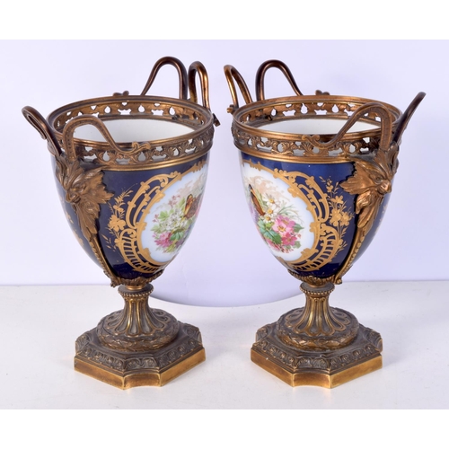 1482 - A PAIR OF 19TH CENTURY FRENCH SEVRES PORCELAIN VASES mounted in bronze. 21 cm x 14 cm.