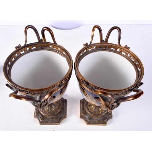 1482 - A PAIR OF 19TH CENTURY FRENCH SEVRES PORCELAIN VASES mounted in bronze. 21 cm x 14 cm.