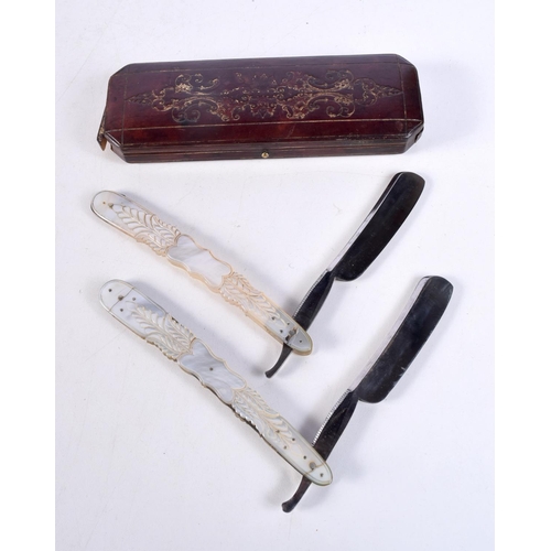 1487 - A PAIR OF ANTIQUE MOTHER OF PEARL RAZORS. 24.5 cm long extended.