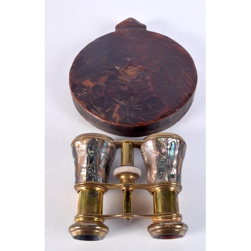 1493 - AN ANTIQUE TREEN PAT and a pair of abalone shell opera glasses. Largest 13 cm x 15 cm. (2)