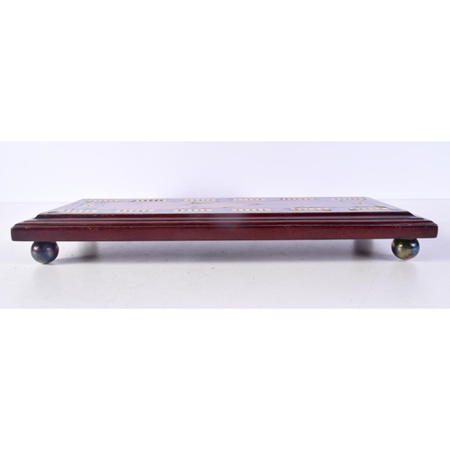 1495B - AN ANTIQUE CARVED WOOD AND IVORINE GAMING BOARD. 37 cm x 15 cm.