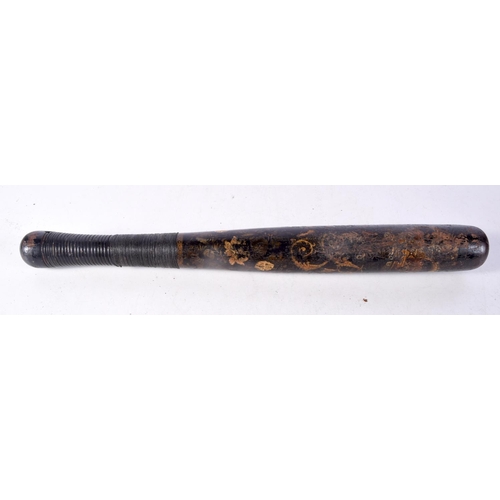 1495C - AN ANTIQUE CARVED WOOD PAINTED TRUNCHEON. 40 cm long.