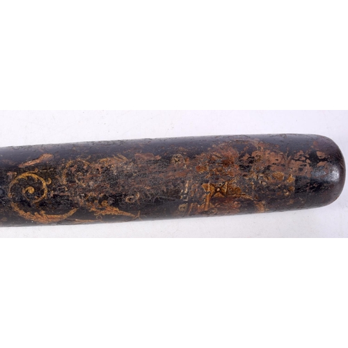 1495C - AN ANTIQUE CARVED WOOD PAINTED TRUNCHEON. 40 cm long.