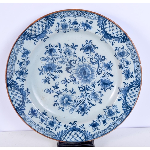 1495E - A LARGE 18TH CENTURY DUTCH DELFT BLUE AND WHITE PLATE together with a smaller plate. Largest 33 cm d... 