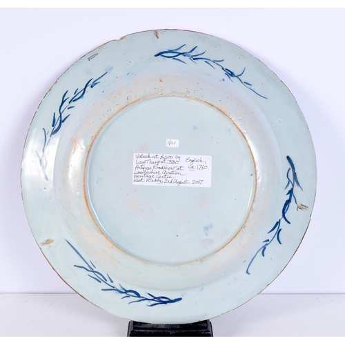 1495E - A LARGE 18TH CENTURY DUTCH DELFT BLUE AND WHITE PLATE together with a smaller plate. Largest 33 cm d... 