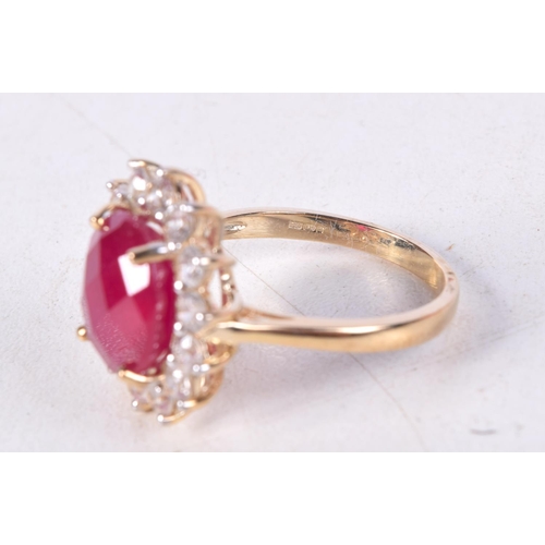 750 - A 9CT GOLD, CZ AND RED GEM RING.  Stamped 9K, Size R, weight 5.7g