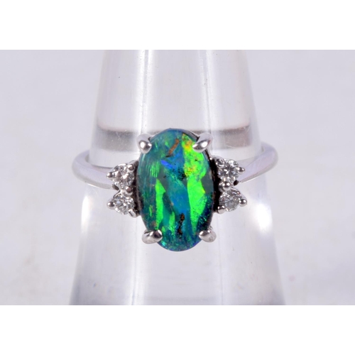 752 - A 14CT WHITE GOLD, DIAMOND AND OPAL RING.  Stamped 475, Size L, weight 3.3g