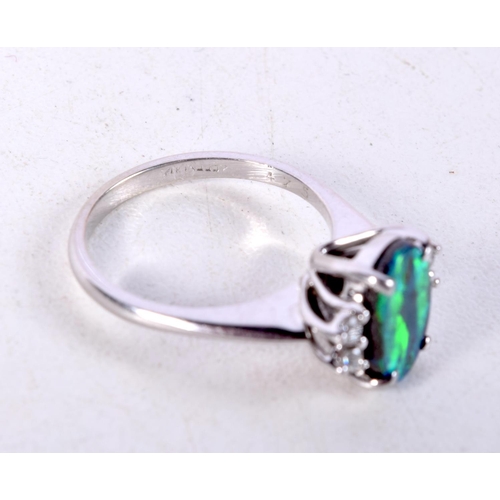 752 - A 14CT WHITE GOLD, DIAMOND AND OPAL RING.  Stamped 475, Size L, weight 3.3g