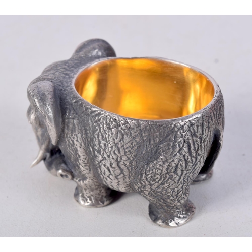 756 - A CONTINENTAL SILVER SALT IN THE FORM OF AN ELEPHANT WITH GILT INTERIOR.  Stamped 84, 3cm x 4.8cm x ... 