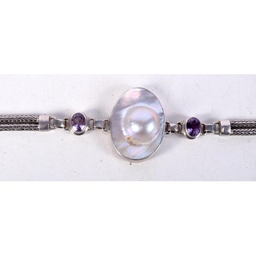 761 - A SILVER BRACELET WITH MOTHER OF PEARL AND GEMS.  Stamped 925, Length 17cm, weight 21.4g