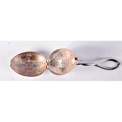 801 - A STERLING SILVER LOOSE TEA INFUSER.  Stamped Sterling, 14cm x 3.2cm, weight 29g