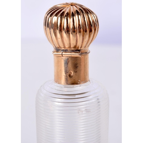 804 - AN 18CT GOLD TOPPED SCENT BOTTLE.  Indistinguishable marks, 9.1cm x 2.4cm