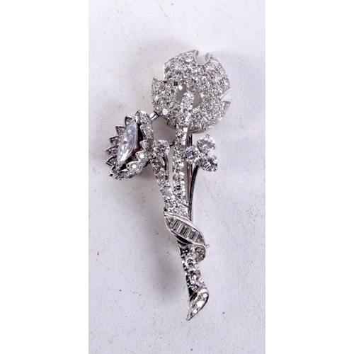 807 - A PLATINUM AND DIAMOND FLOWER BROOCH.  4.4cm x 1.9cm, weight 6.5g