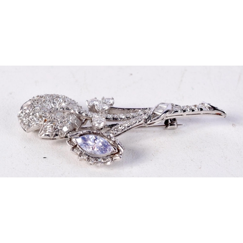 807 - A PLATINUM AND DIAMOND FLOWER BROOCH.  4.4cm x 1.9cm, weight 6.5g