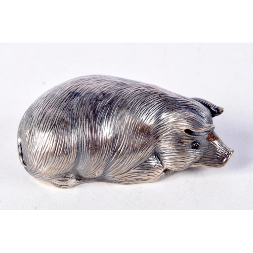 812 - A CONTINENTAL SILVER PIG WITH GEM SET EYES.  Stamped 88, 2.4cm x 6cm x 3.1cm, weight 30.8g