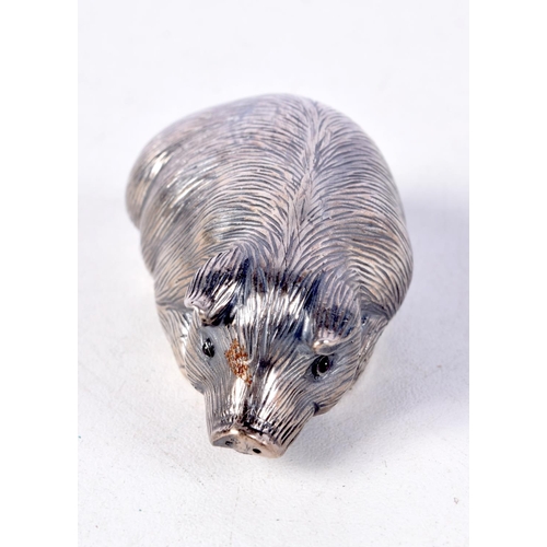 812 - A CONTINENTAL SILVER PIG WITH GEM SET EYES.  Stamped 88, 2.4cm x 6cm x 3.1cm, weight 30.8g