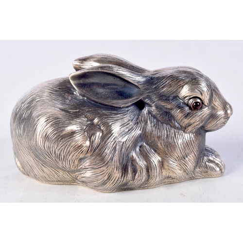 818 - A CONTINENTAL SILVER RABBIT WITH GEM SET EYES.  Stamped 88, 3.7cm x 7cm x 4cm, weight 63.1g