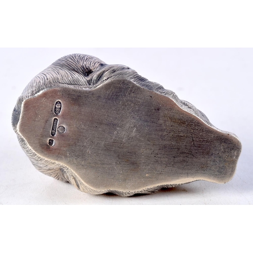 818 - A CONTINENTAL SILVER RABBIT WITH GEM SET EYES.  Stamped 88, 3.7cm x 7cm x 4cm, weight 63.1g