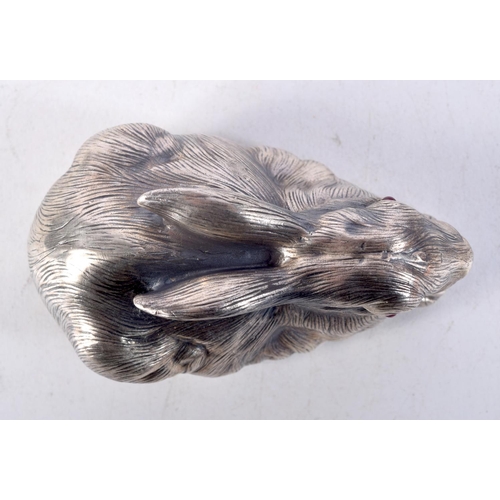 818 - A CONTINENTAL SILVER RABBIT WITH GEM SET EYES.  Stamped 88, 3.7cm x 7cm x 4cm, weight 63.1g