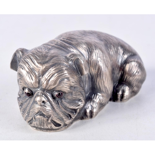 819 - A CONTINENTAL SILVER DOG WITH GEM SET EYES.  Stamped 88, 3.2cm x 6.5cm x 3.6cm, weight 60.3g