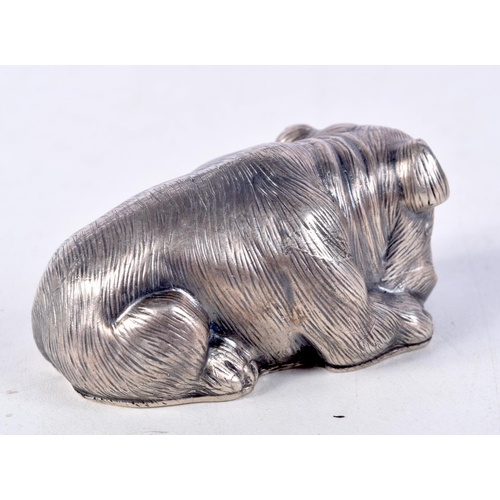 819 - A CONTINENTAL SILVER DOG WITH GEM SET EYES.  Stamped 88, 3.2cm x 6.5cm x 3.6cm, weight 60.3g