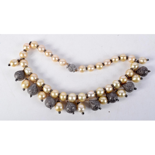 828 - A DIAMOND AND PEARL NECKLACE.  40cm long, largest pearl 12mm, weight 140g