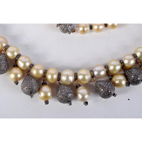 828 - A DIAMOND AND PEARL NECKLACE.  40cm long, largest pearl 12mm, weight 140g