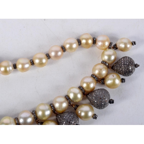 828 - A DIAMOND AND PEARL NECKLACE.  40cm long, largest pearl 12mm, weight 140g